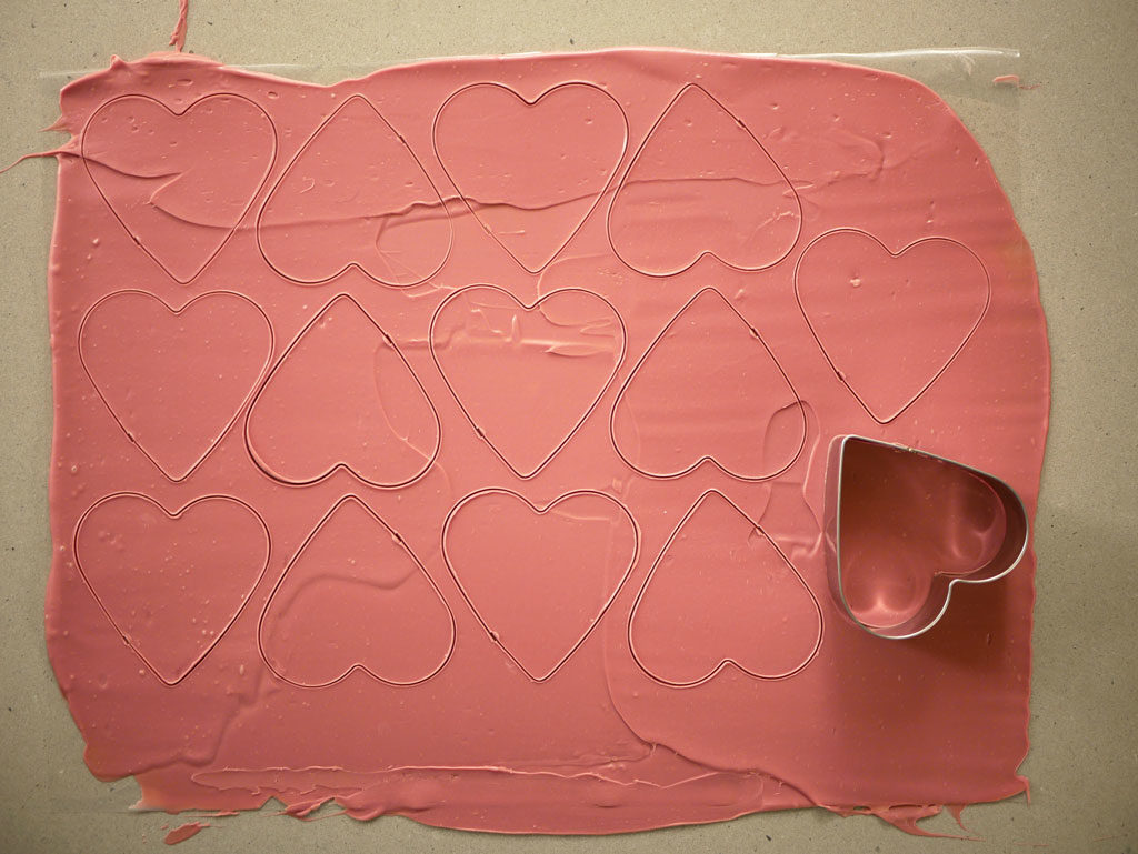 Cutting out ruby chocolate hearts