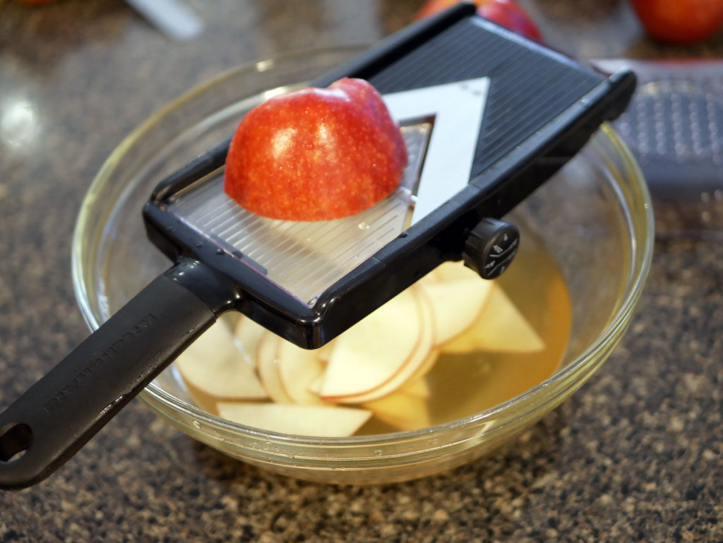 Slicing the apples with a mandoline